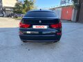 2011 BMW 5 серии Gran Turismo 550i xDrive VI (F10/F11/F07), чёрный, 1670000 рублей - вид 4