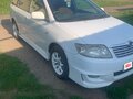2004 Toyota Corolla Fielder IX (E120, E130), белый, 750000 рублей - вид 1