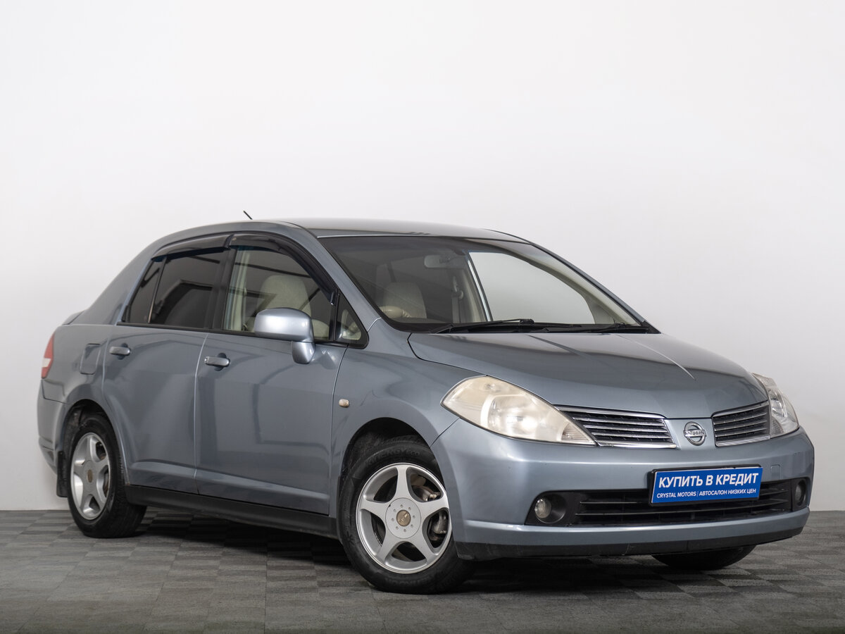 Открыть фотографии: Nissan Tiida I