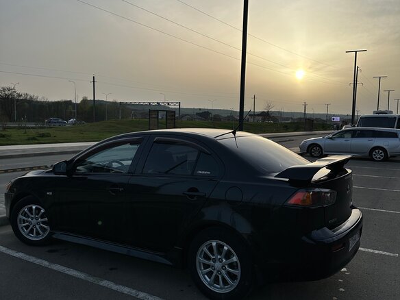 2010 Mitsubishi Lancer X, чёрный, 720000 рублей - вид 8