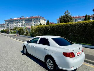 2010 Toyota Corolla X (E140, E150), белый, 1055000 рублей, вид 2