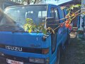 1987 Isuzu Elf (N-series), синий, 400000 рублей - вид 1