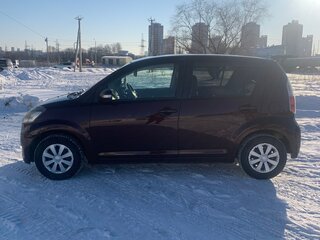 2009 Toyota Passo I (C10), коричневый, 520000 рублей, вид 4