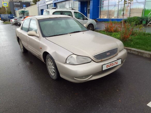 2001 Kia Clarus II, бежевый, 185000 рублей
