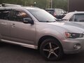 2010 Mitsubishi Outlander II Рестайлинг, серебристый, 1300000 рублей - вид 1