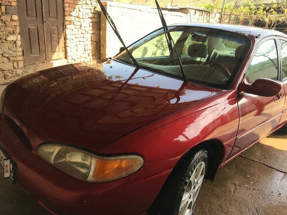 1996 Ford Escort (North America) III, красный - вид 5