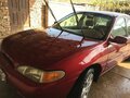 1996 Ford Escort (North America) III, красный - вид 5