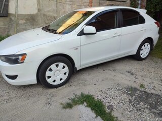 2009 Mitsubishi Lancer X, белый, 655000 рублей, вид 4