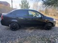 2011 Chevrolet Aveo I Рестайлинг, чёрный, 600000 рублей - вид 1