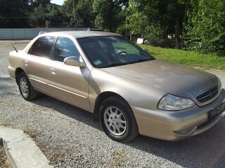 1999 Kia Clarus II, бежевый, 380000 рублей, вид 2