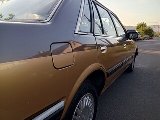 1987 Nissan Laurel V (C32), коричневый, 1100000 рублей, вид 5