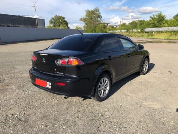 2014 Mitsubishi Lancer X Рестайлинг, чёрный, 980000 рублей - вид 9