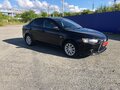 2014 Mitsubishi Lancer X Рестайлинг, чёрный, 980000 рублей - вид 2
