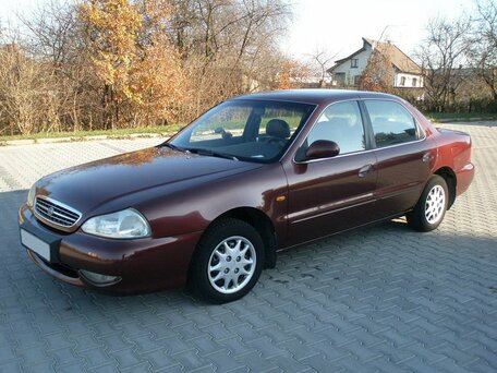 1998 Kia Clarus II, серый, 245000 рублей